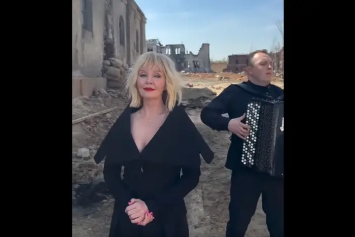 Valeriya performs a song among the ruins